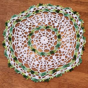 Vintage crocheted doily, green and white circle
